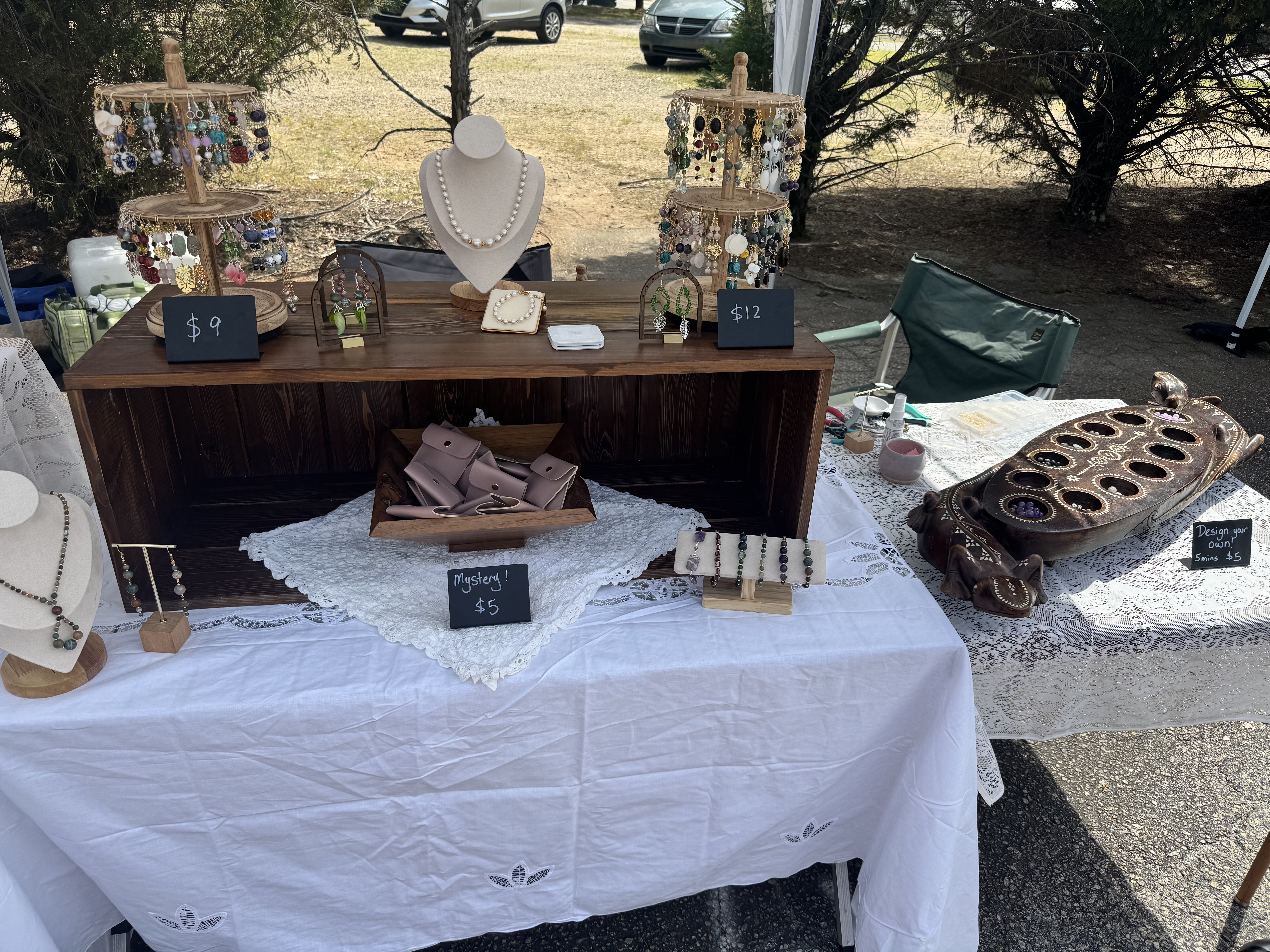 Marie Firestone market booth with pearl necklace and earring displays